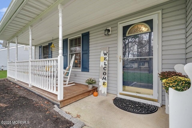 doorway to property with a porch