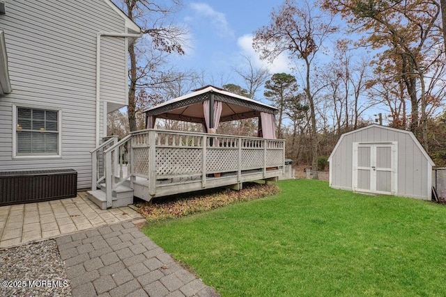 exterior space with a shed, a gazebo, and a deck