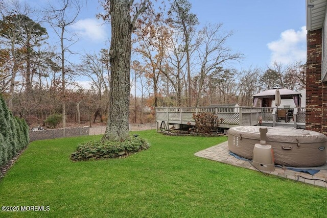 view of yard with a wooden deck and a gazebo