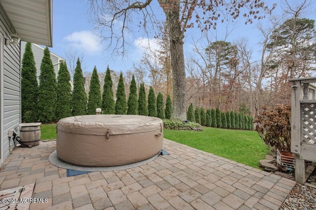 view of patio / terrace with a hot tub