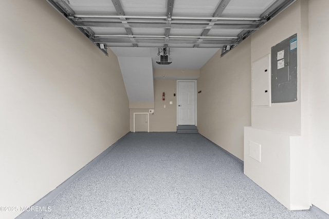 garage featuring a garage door opener and electric panel