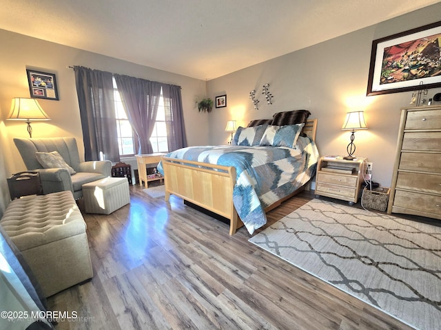 bedroom with hardwood / wood-style flooring