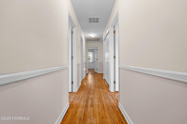 corridor featuring light hardwood / wood-style flooring