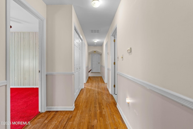 hall with light hardwood / wood-style floors