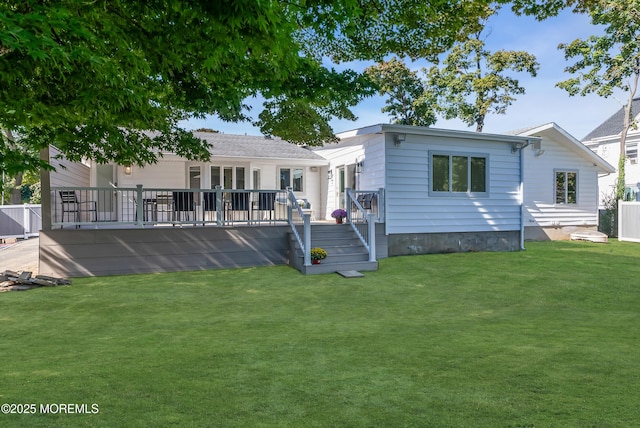 view of front of property with a wooden deck and a front yard