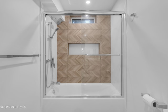 bathroom featuring shower / bath combination with glass door