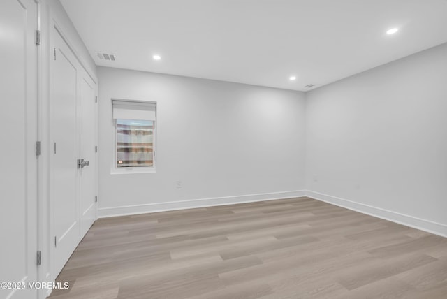 unfurnished room with light hardwood / wood-style floors