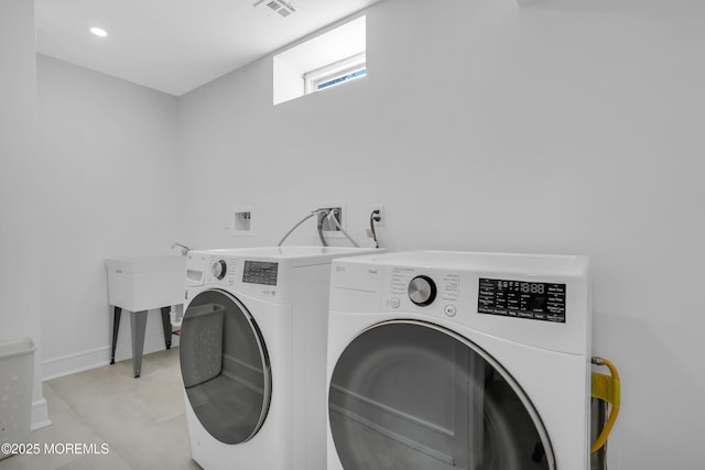 laundry area with washer and dryer