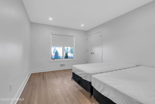 bedroom featuring light wood-type flooring