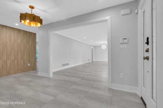 foyer entrance with a chandelier