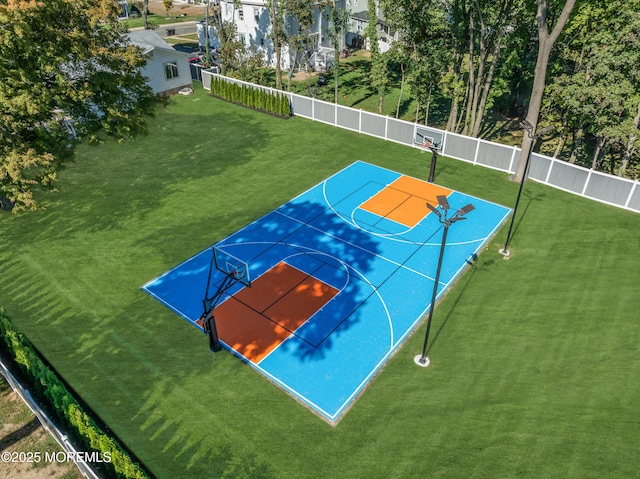 view of basketball court featuring a lawn