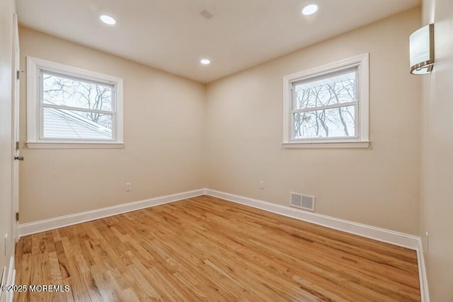 spare room featuring light hardwood / wood-style flooring