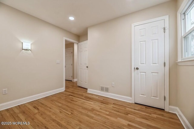 unfurnished bedroom with light hardwood / wood-style flooring