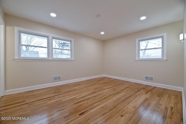 unfurnished room featuring light hardwood / wood-style flooring