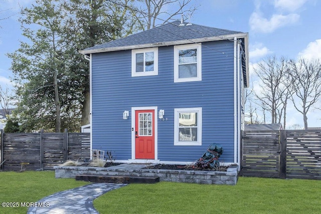 view of front of home with a front lawn