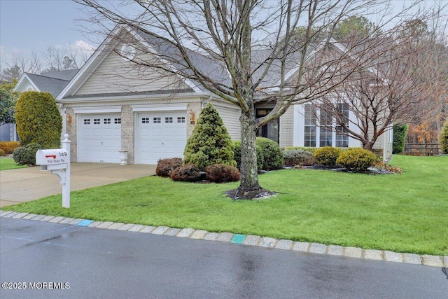 view of front of home with a garage and a front yard