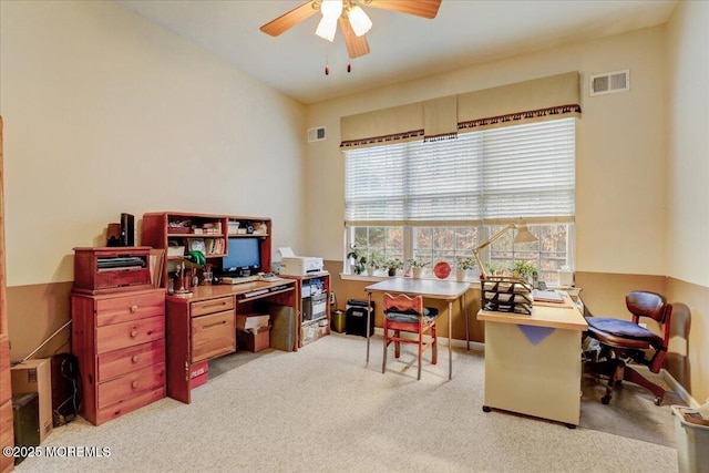 office space with light carpet and ceiling fan