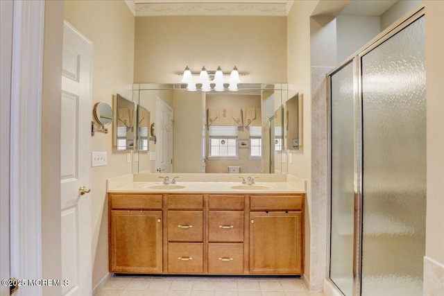 bathroom featuring vanity, tile patterned flooring, and walk in shower