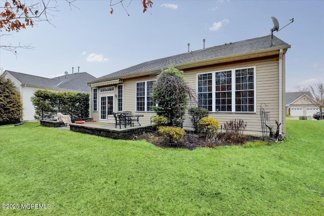 back of house with a yard and a patio area