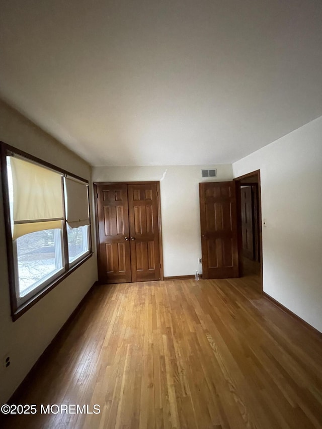 unfurnished bedroom featuring light hardwood / wood-style flooring