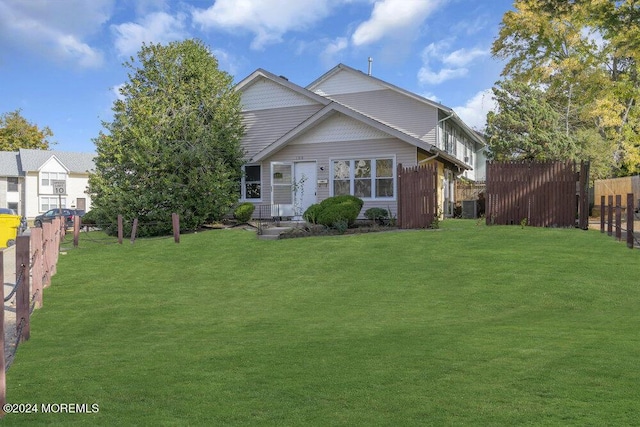 rear view of house with a lawn