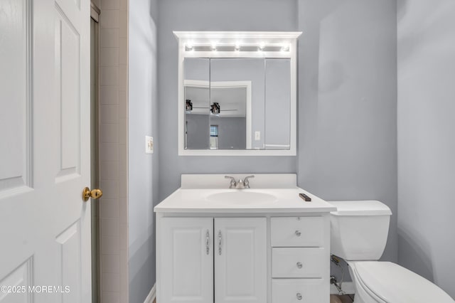 bathroom with vanity and toilet