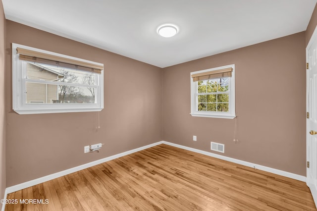 unfurnished room featuring light wood-type flooring