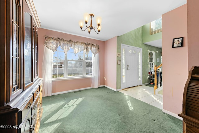 entryway featuring light carpet and a chandelier