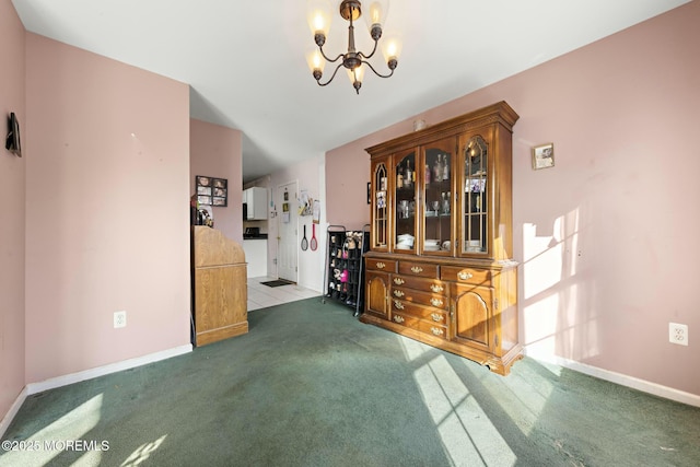 carpeted dining space featuring a notable chandelier