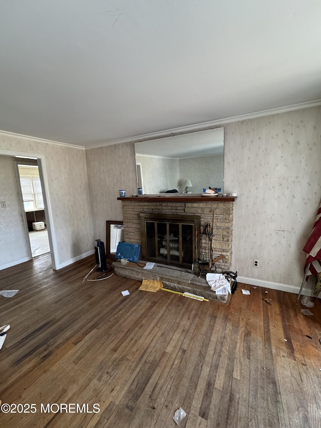 unfurnished living room featuring crown molding and hardwood / wood-style floors