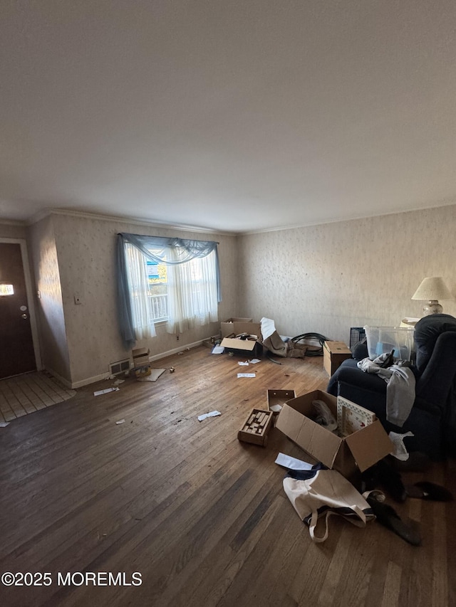 miscellaneous room featuring hardwood / wood-style flooring and ornamental molding