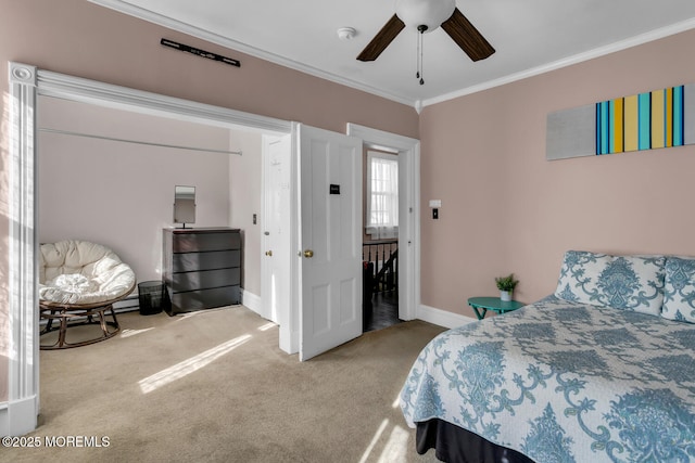 bedroom with crown molding, carpet, and ceiling fan