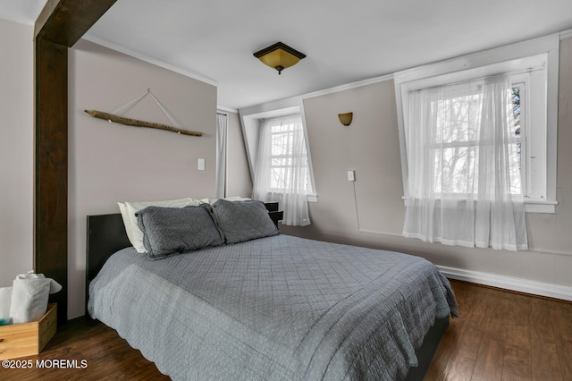 bedroom with dark hardwood / wood-style flooring