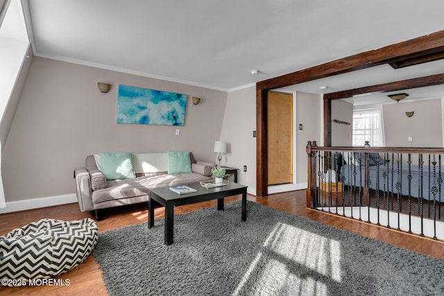 living room with crown molding, wood-type flooring, and beam ceiling