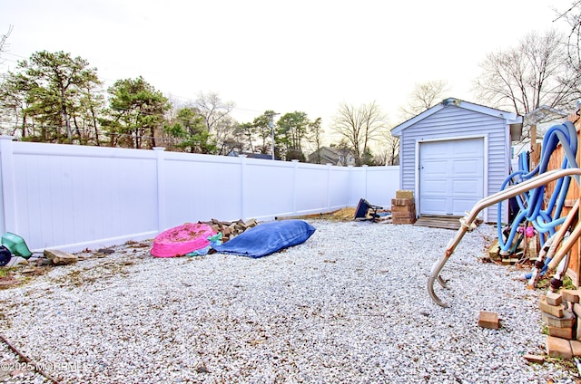 view of yard with an outbuilding and a garage