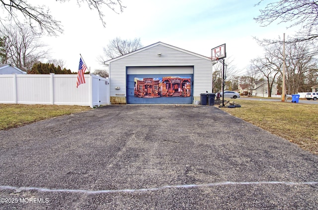 garage featuring a lawn