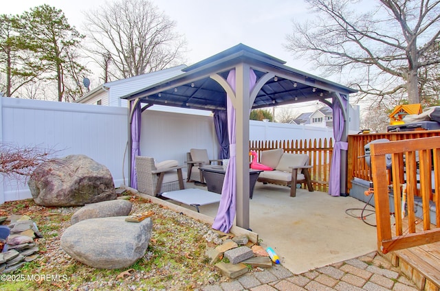 view of patio featuring an outdoor living space and a gazebo