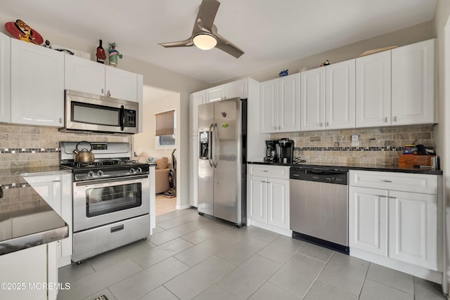 kitchen featuring stainless steel appliances and white cabinets