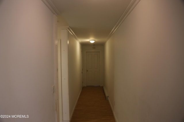 hall with hardwood / wood-style floors and crown molding