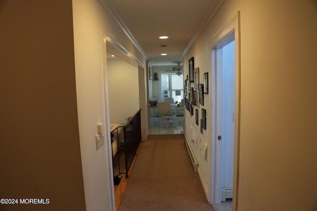 hall with ornamental molding, carpet flooring, and baseboard heating