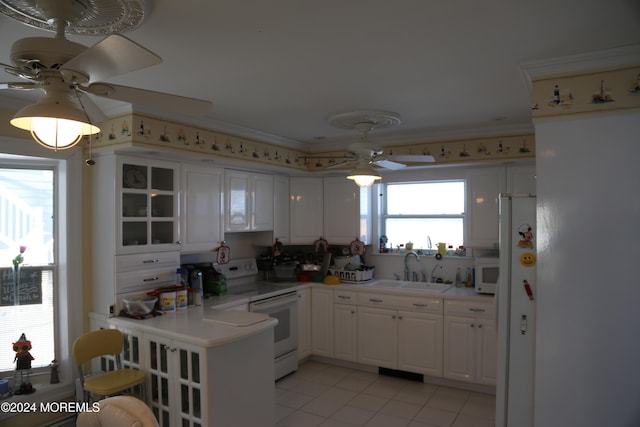 kitchen featuring white cabinetry, white appliances, ceiling fan, and sink