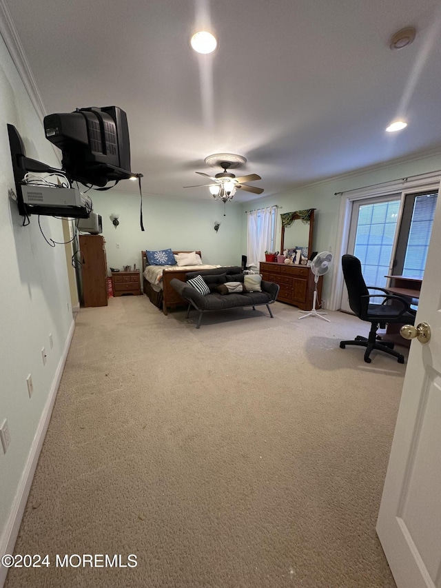 bedroom featuring ceiling fan, ornamental molding, and carpet floors