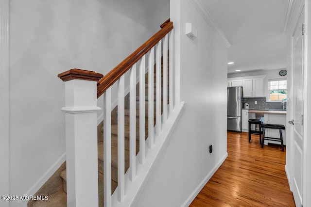 staircase featuring hardwood / wood-style flooring