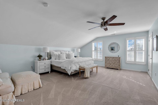 carpeted bedroom featuring vaulted ceiling and ceiling fan