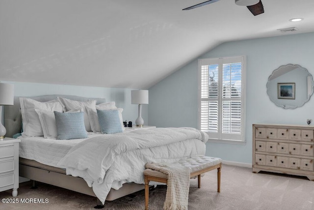 carpeted bedroom featuring vaulted ceiling and ceiling fan