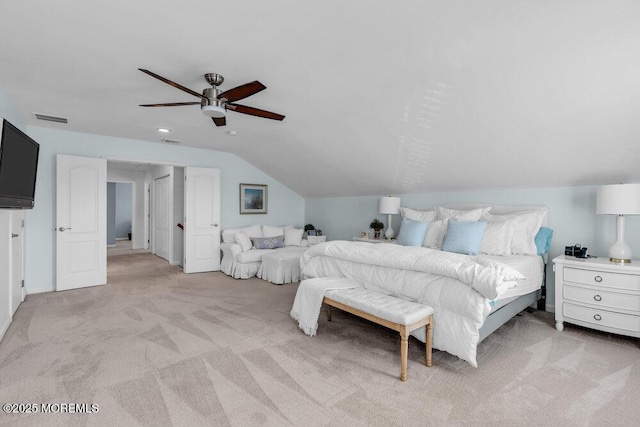 bedroom with vaulted ceiling, light colored carpet, and ceiling fan