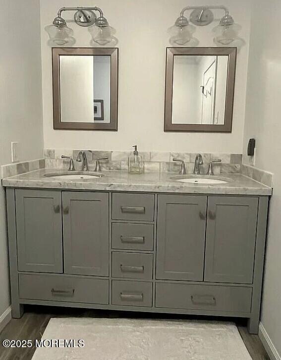 bathroom featuring vanity and hardwood / wood-style flooring