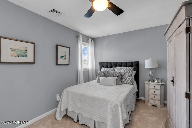 bedroom featuring ceiling fan and light carpet