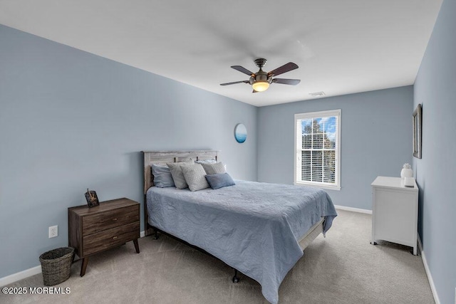 bedroom with light colored carpet and ceiling fan