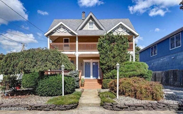 view of front of home with a balcony